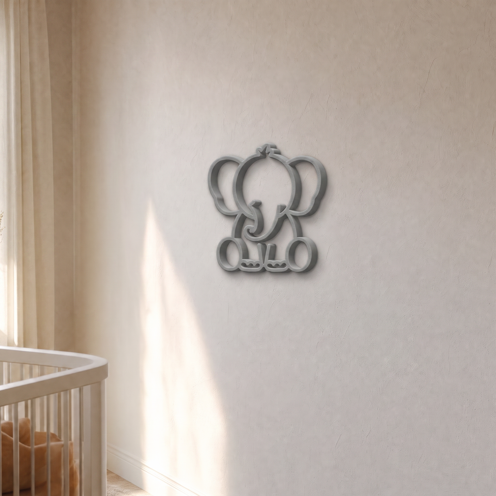 Grey elephant wall art in warm afternoon light on a plaster nursery wall