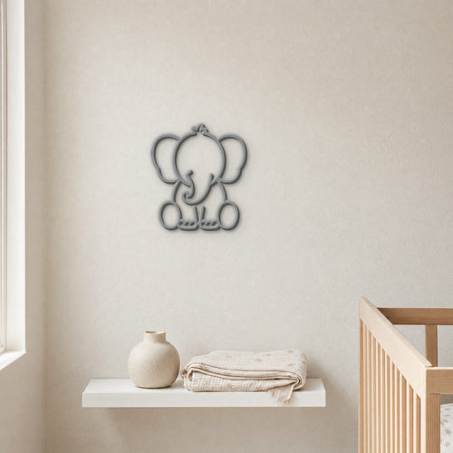 Grey 3D printed elephant wall art above a nursery shelf