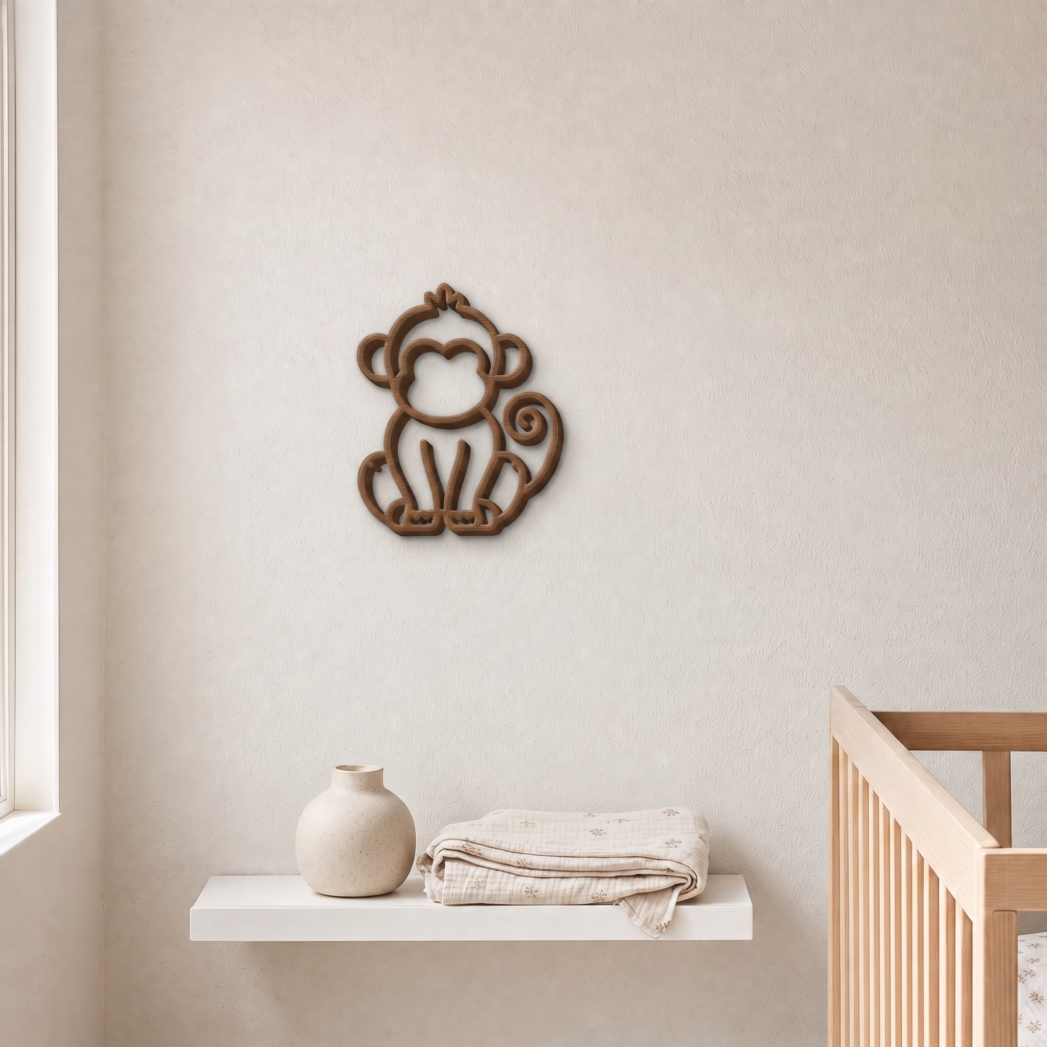 Beige 3D printed monkey wall art above a nursery shelf