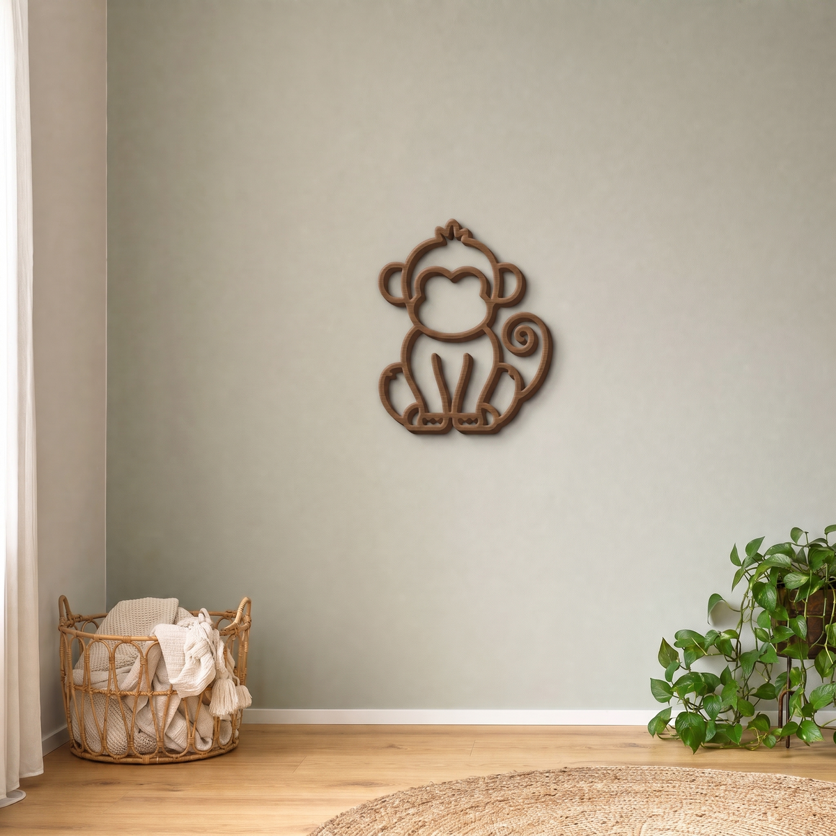 Beige monkey wall art on a sage green nursery wall