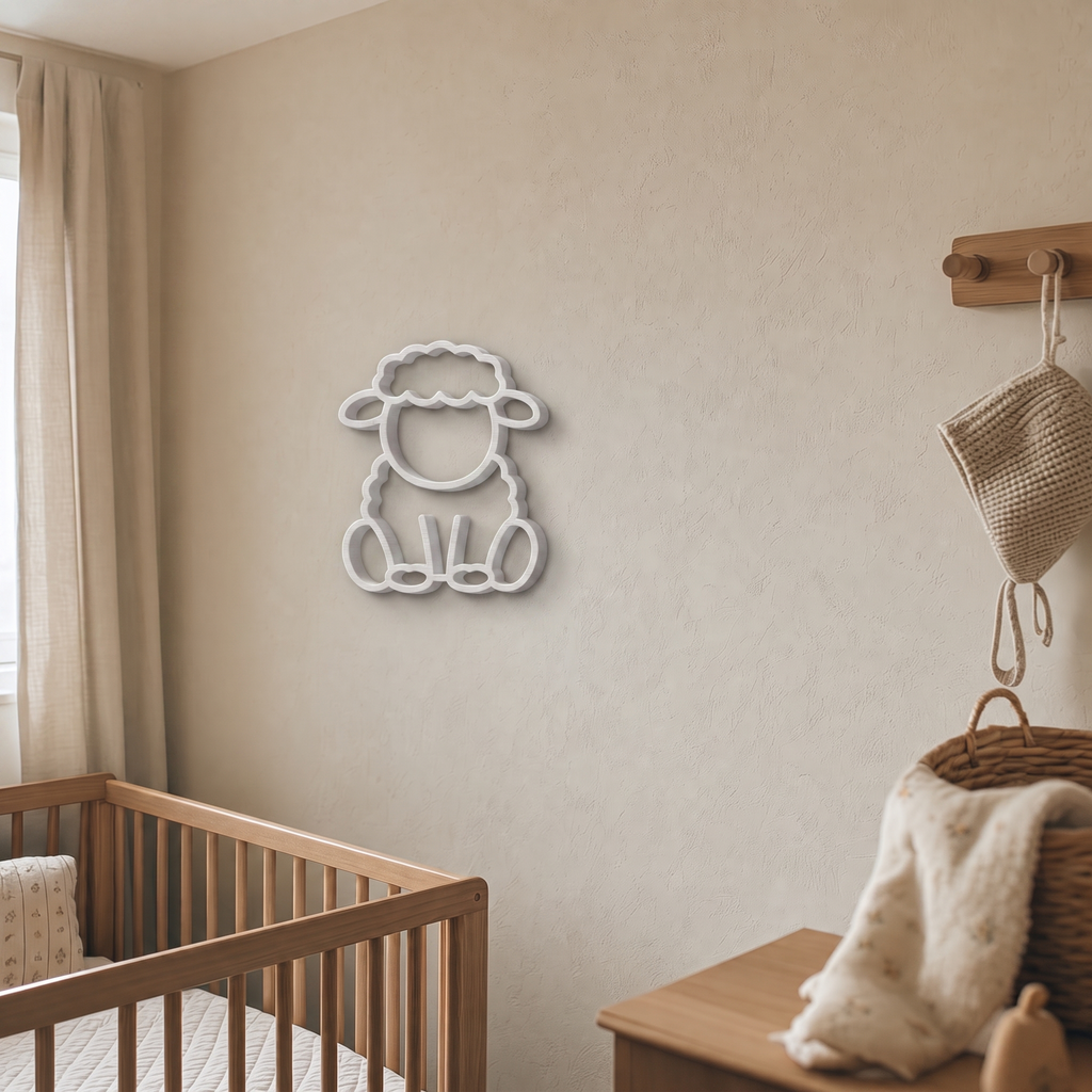 White sheep wall art beside a wooden peg rail in a nursery
