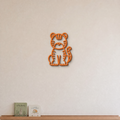 Tiger nursery wall art in orange, 3D printed striped outline on a nursery wall