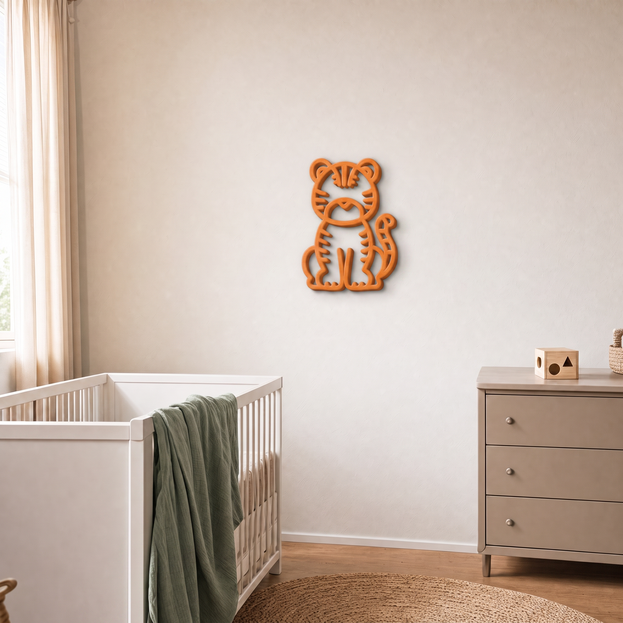 Orange 3D printed tiger wall art in a nursery with cot and drawers