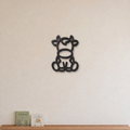Cow nursery wall art in black, 3D printed outline on a nursery wall