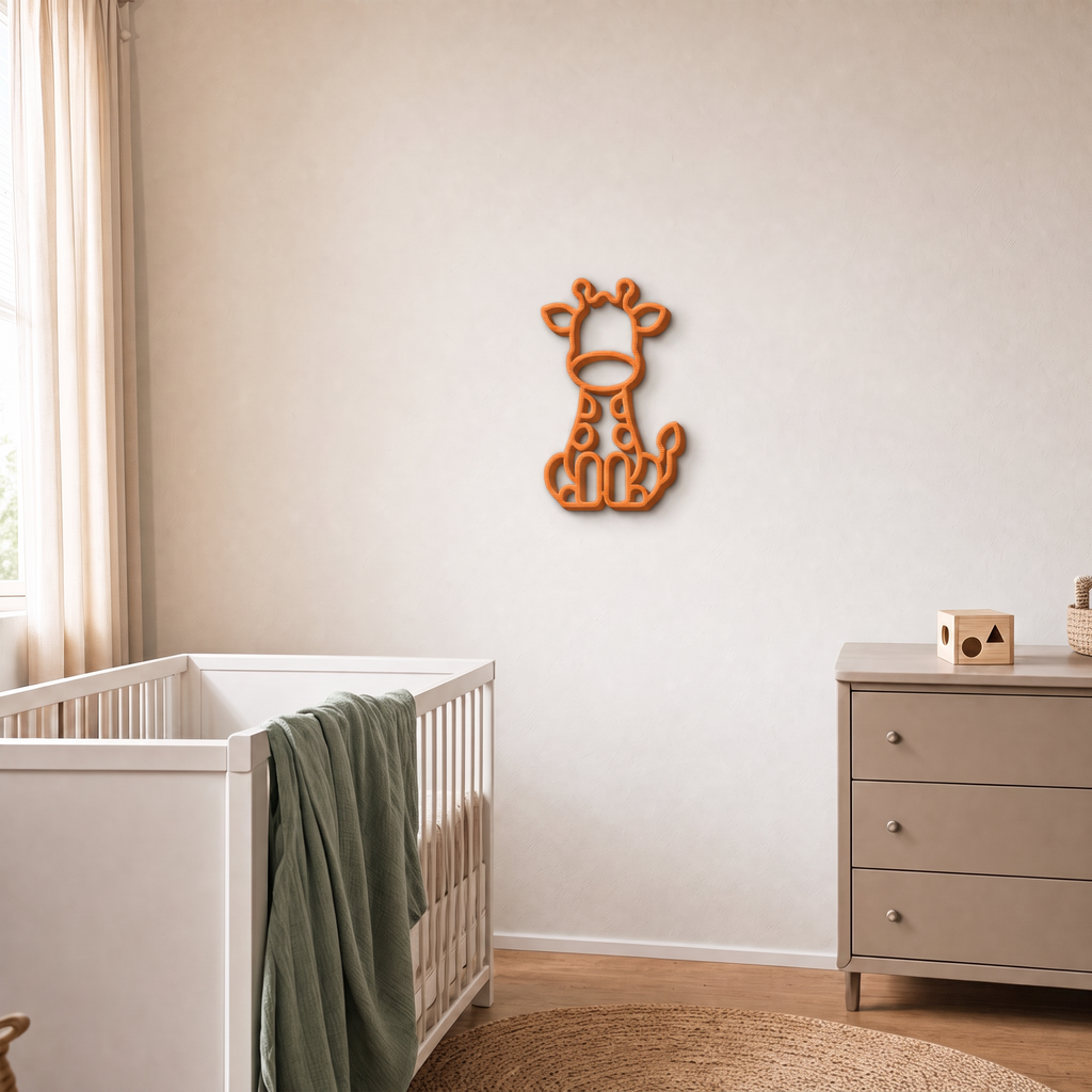 Orange 3D printed giraffe wall art in a nursery with cot and drawers